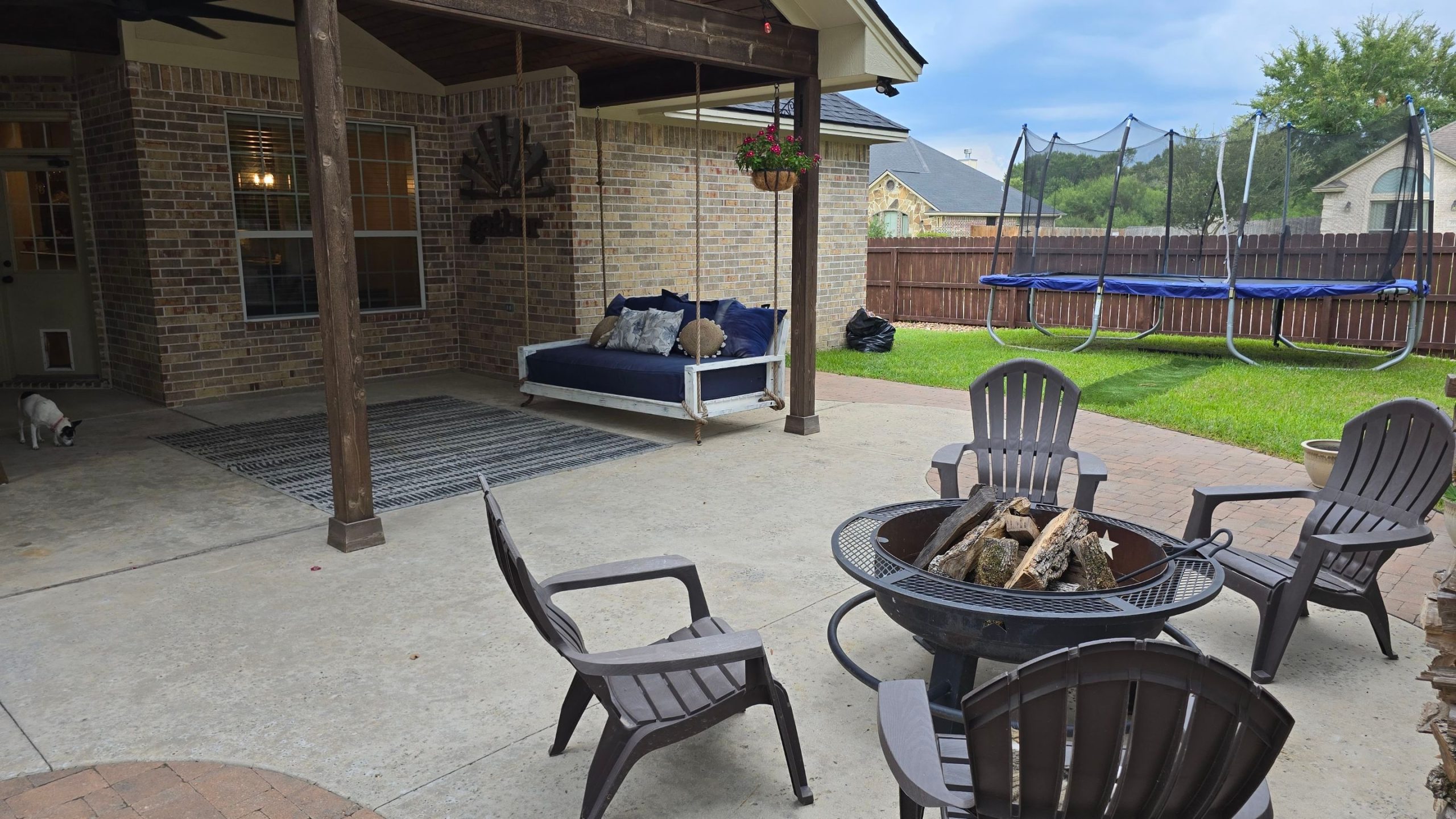 Rustic patio ideas for a cozy outdoor retreat | h3 outdoor design & construction Rustic Covered Patio Design with a Fire Pit in College Station, Texas
