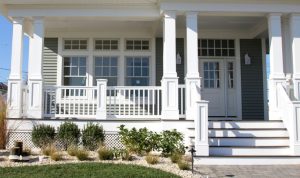 Elegant Pillared Porch Featuring Symmetrical Double Column Design for Added Curb Appeal